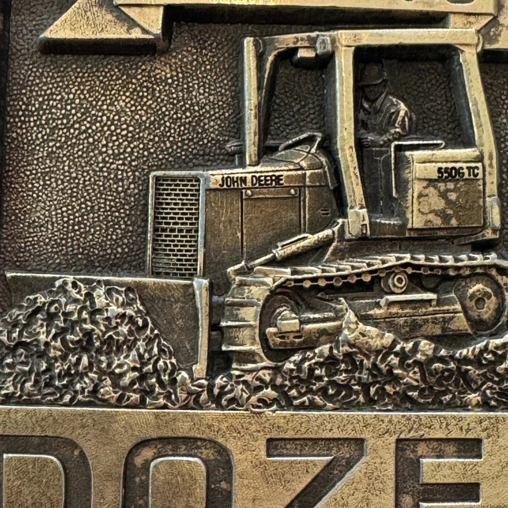 John Deere vintage brass